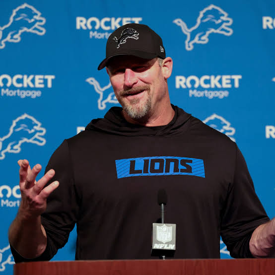 Dan Campbell on the road? That man doesn’t pack bags—he packs body bags….